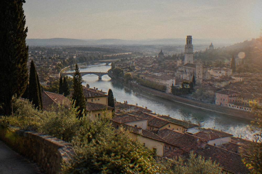 View over Verona's terracotta rooftops and the Adige river from the hills above the city