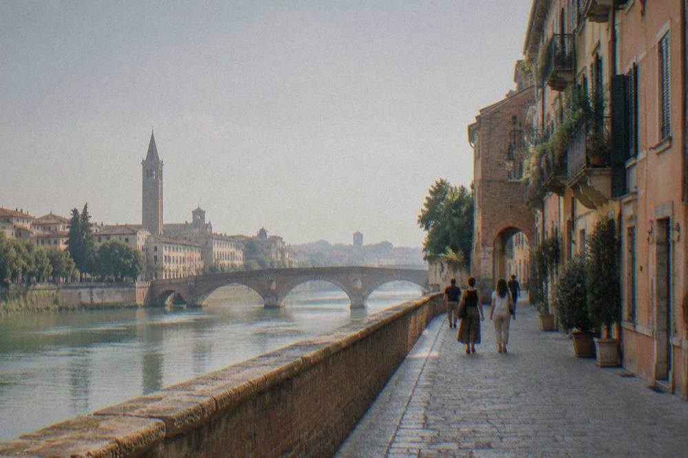 Narrow cobbled street in central Verona lined with old brick and plaster buildings