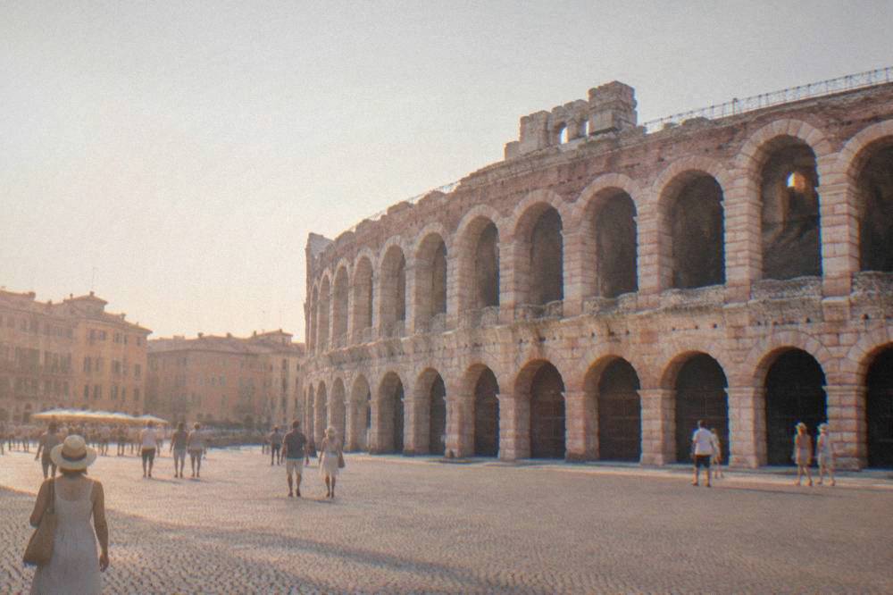 The Verona Arena amphitheatre seen from Piazza Bra in warm evening light