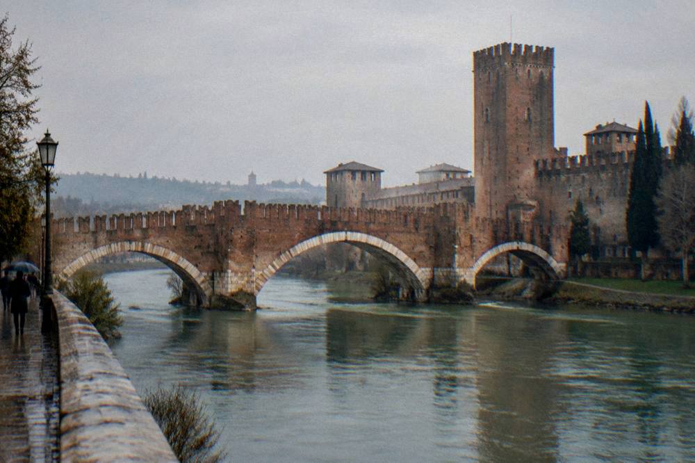Medieval crenellated bridge of Castelvecchio over the Adige river