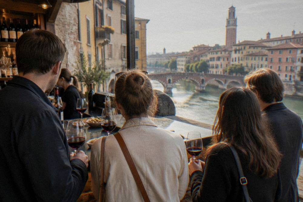 An evening food tour group standing at a counter in a Verona wine bar with glasses of red wine