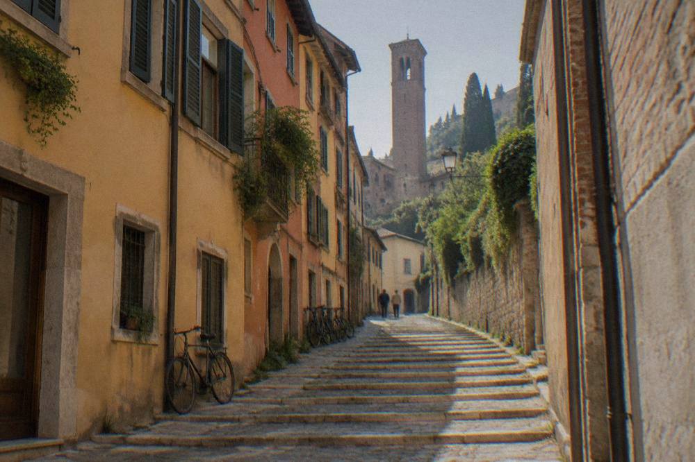 Stone steps and a worn lane climbing the Veronetta hillside toward Castel San Pietro in Verona