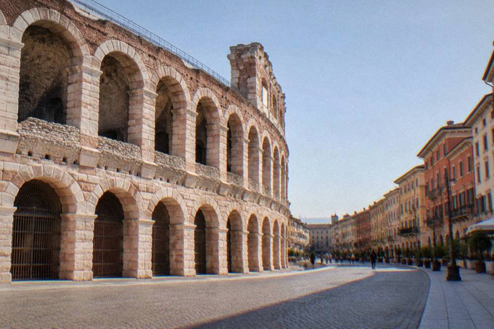 The long shopping street Via Mazzini curving away from the Arena towards the old centre of Verona
