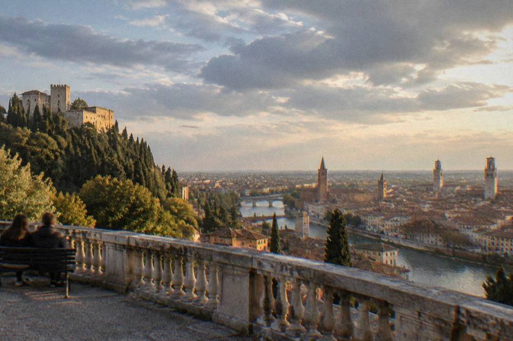 Evening light over Verona's towers and rooftops seen from the hilltop terrace