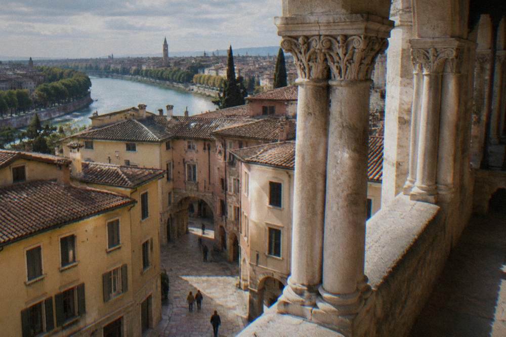 Paired carved columns in the Romanesque cloister of Verona Cathedral