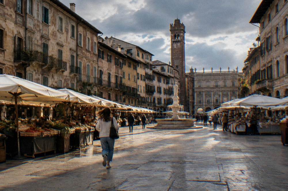 Open market square ringed by painted historic buildings