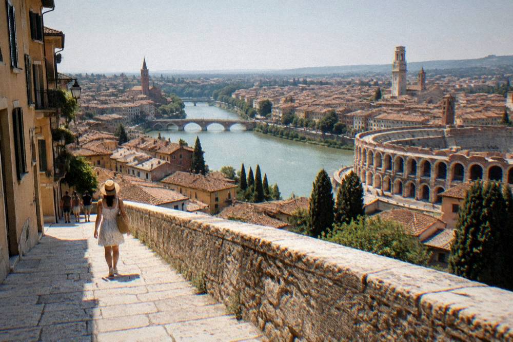 A panoramic view over the terracotta rooftops of Verona and the Adige river from a terrace above the theatre