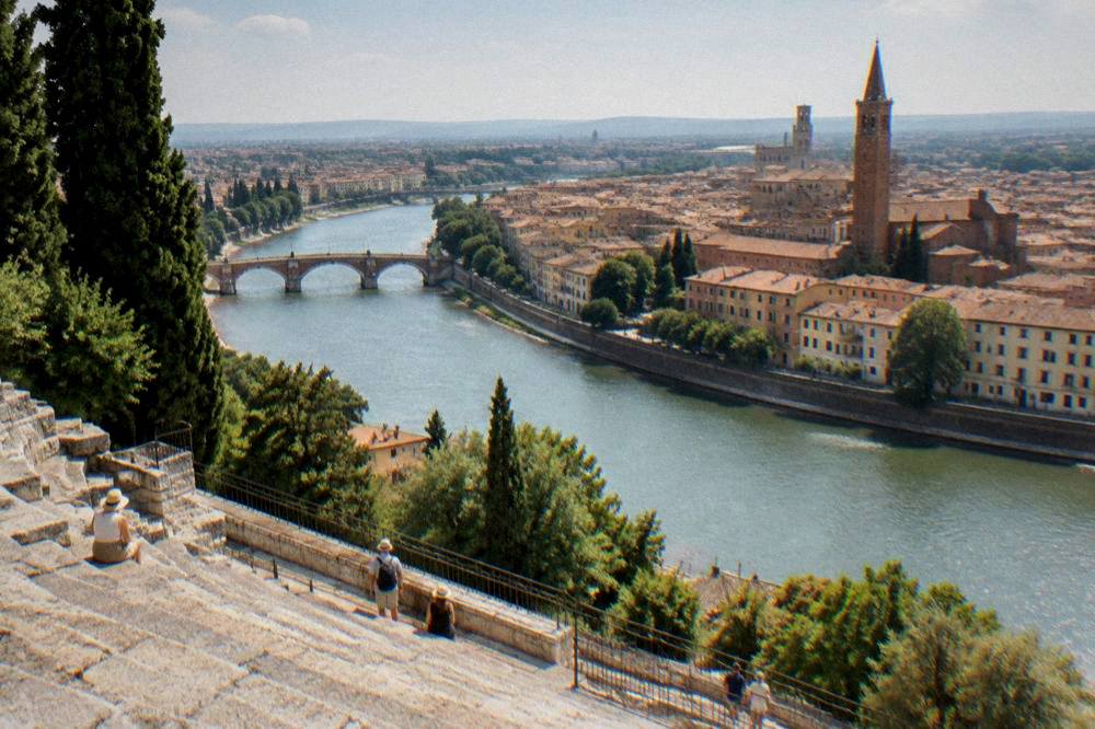 A wide view of the Adige river bending past Verona seen from the terraces of the Roman theatre hillside