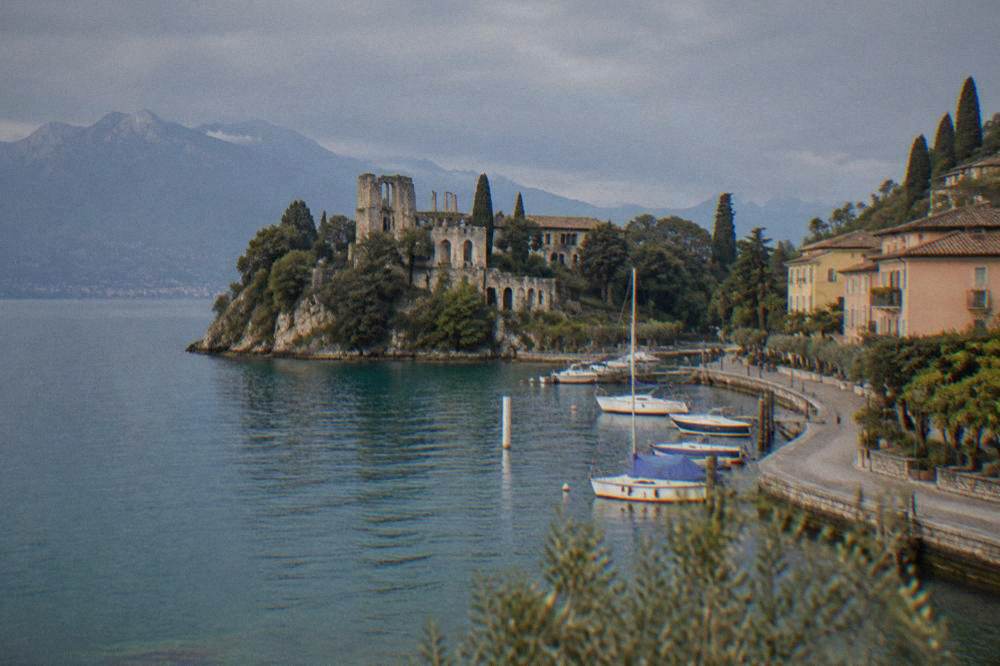 Stone Roman ruins of a villa on a headland with the lake on both sides