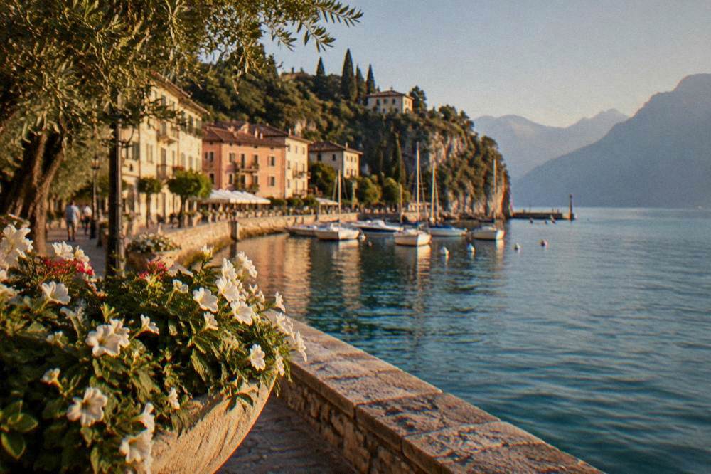 Calm blue lake with a small harbour and mountains in the haze