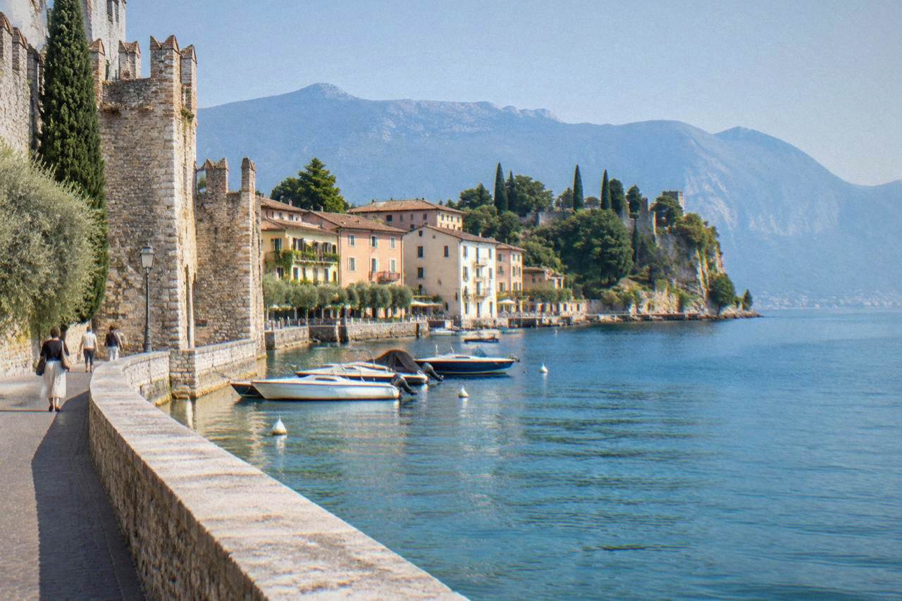 Medieval stone walls and a lakeside promenade in Lazise on Lake Garda