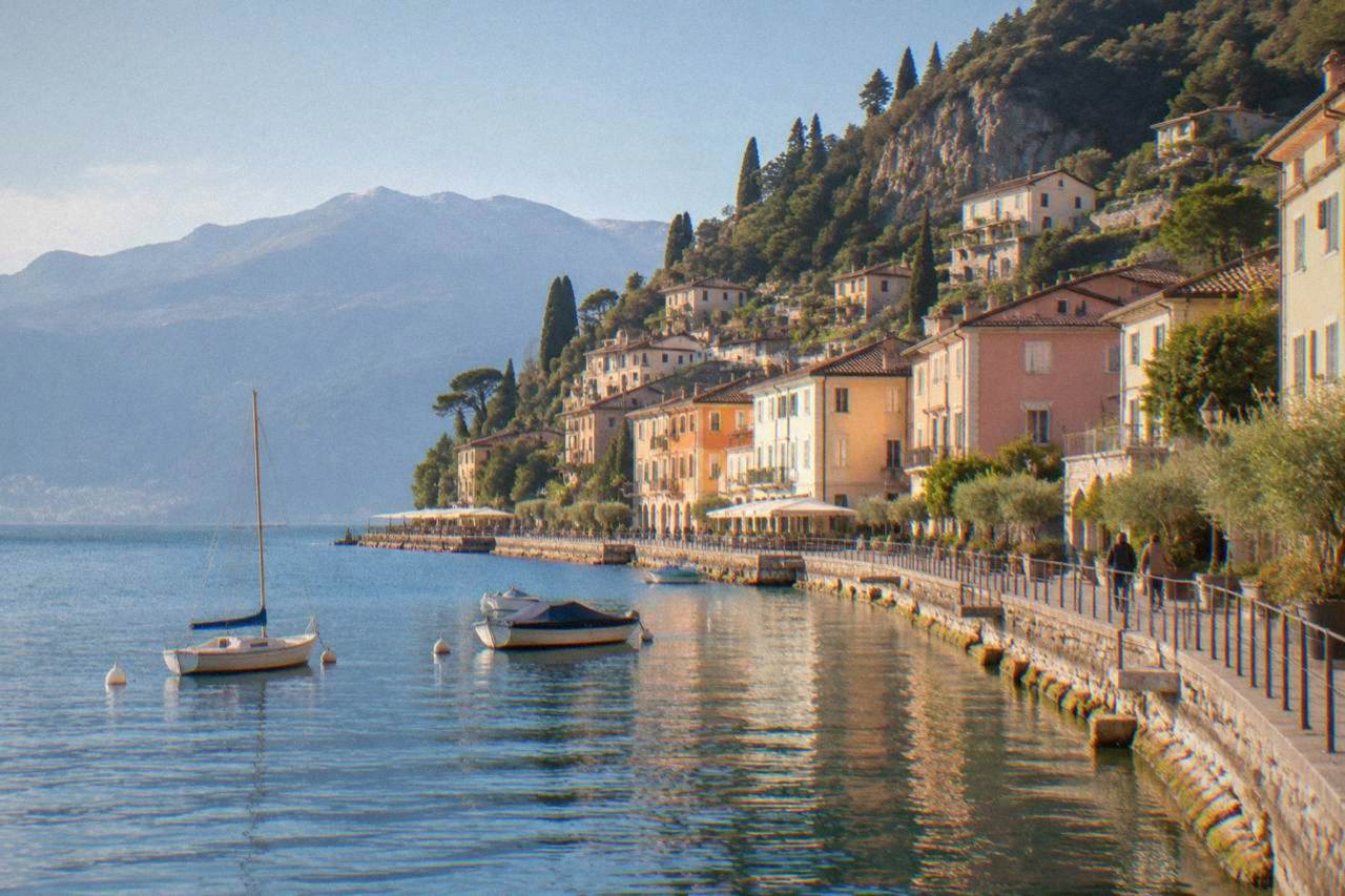 A small lakeside town of pastel buildings and stone terraces rising steeply from the shore of Lake Garda