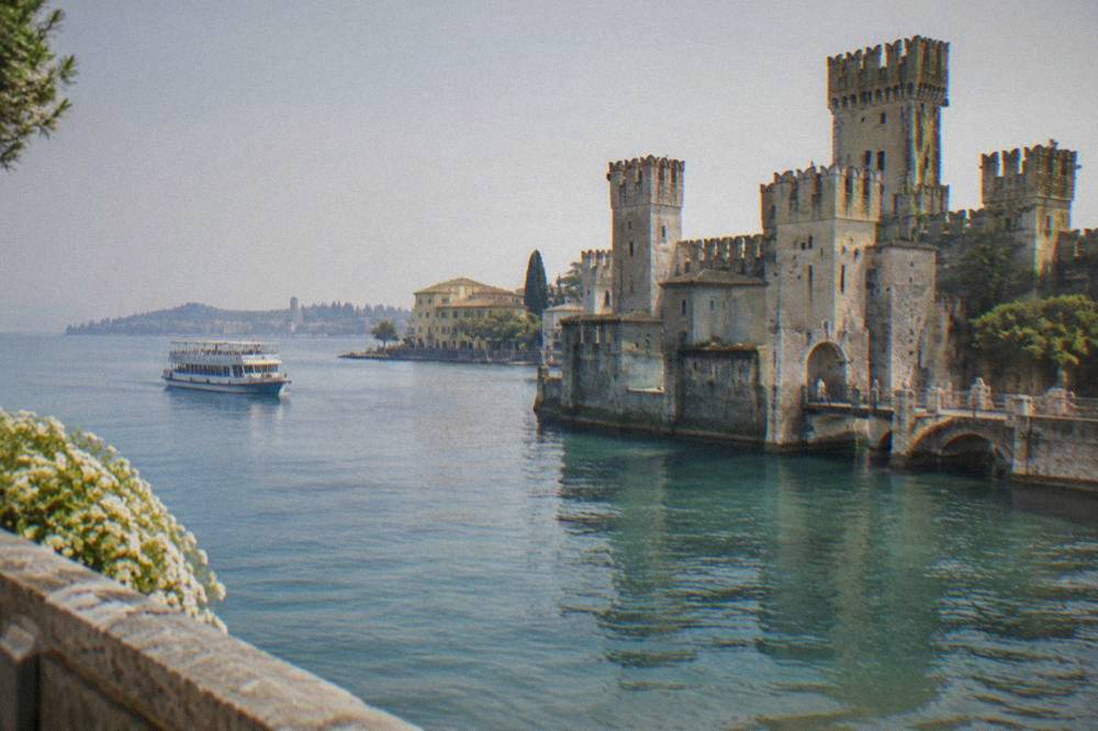 Ferry boat on Lake Garda near Peschiera del Garda with the Sirmione peninsula on the horizon