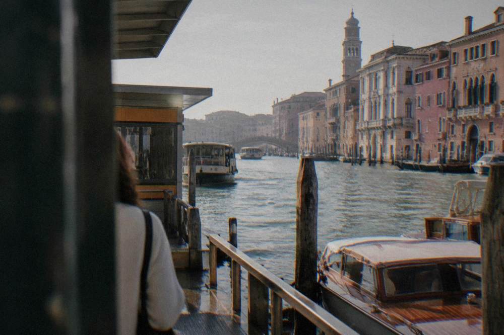 A waterbus stop on the Grand Canal in Venice with moored boats