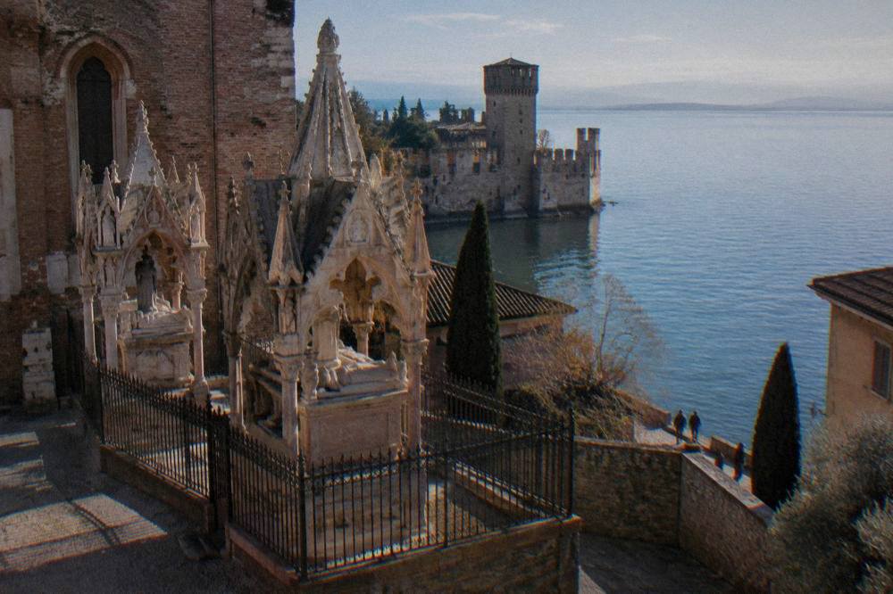 The lakefront at Sirmione on Lake Garda with the Scaliger castle tower