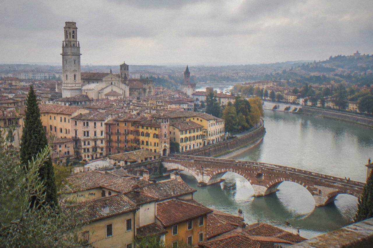 A view over Verona's rooftops showing the Adige river curving around the historic centre