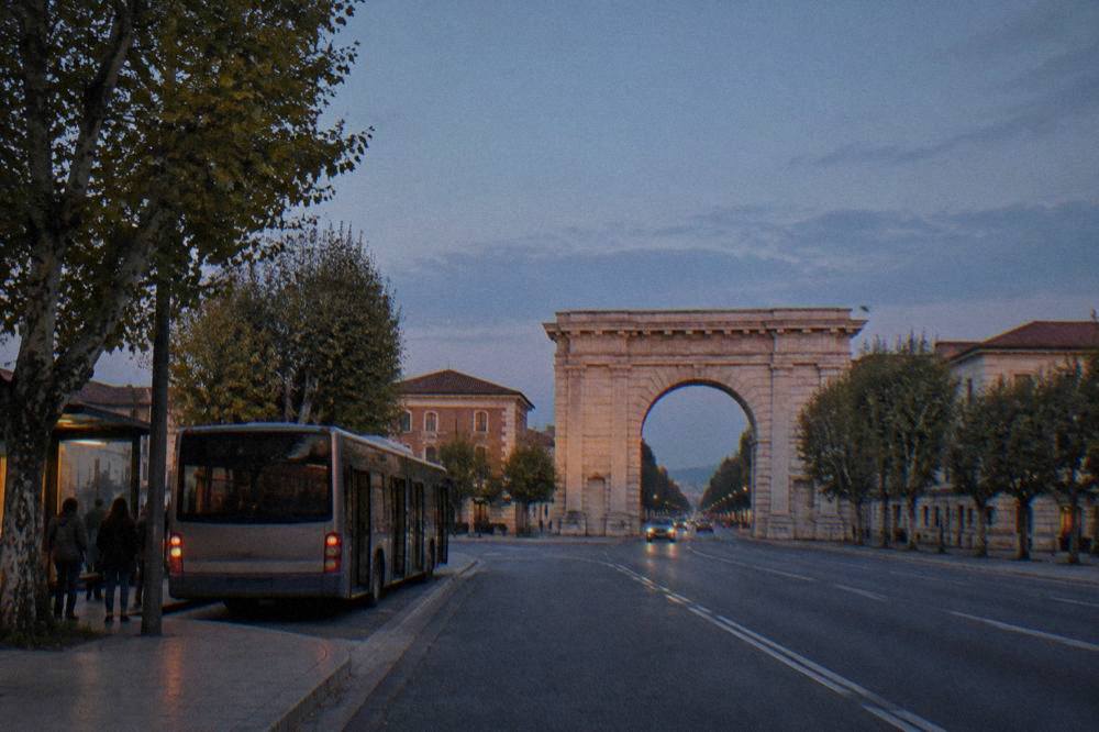 A regional bus waiting at a stop outside Verona Porta Nuova railway station