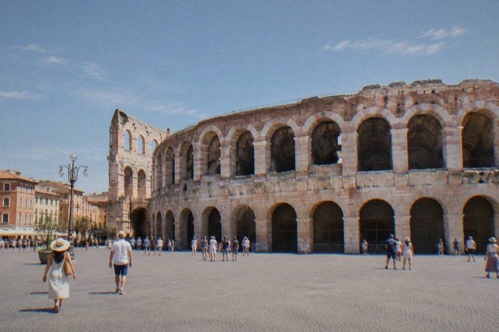 The Roman amphitheatre of Verona seen from Piazza Bra in late afternoon light