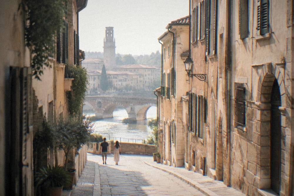 Narrow old street in central Verona with stone buildings and shuttered windows
