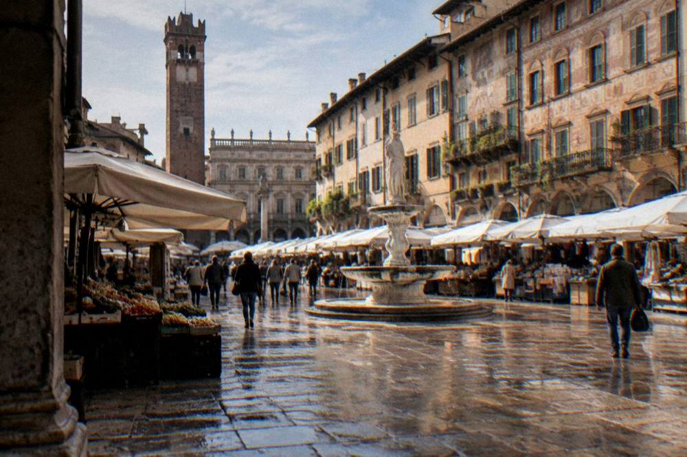 A busy old market square in Verona lined with historic painted buildings