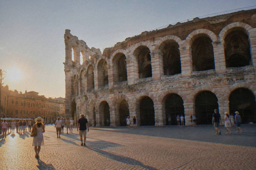 A vast Roman amphitheatre in a European square at golden hour
