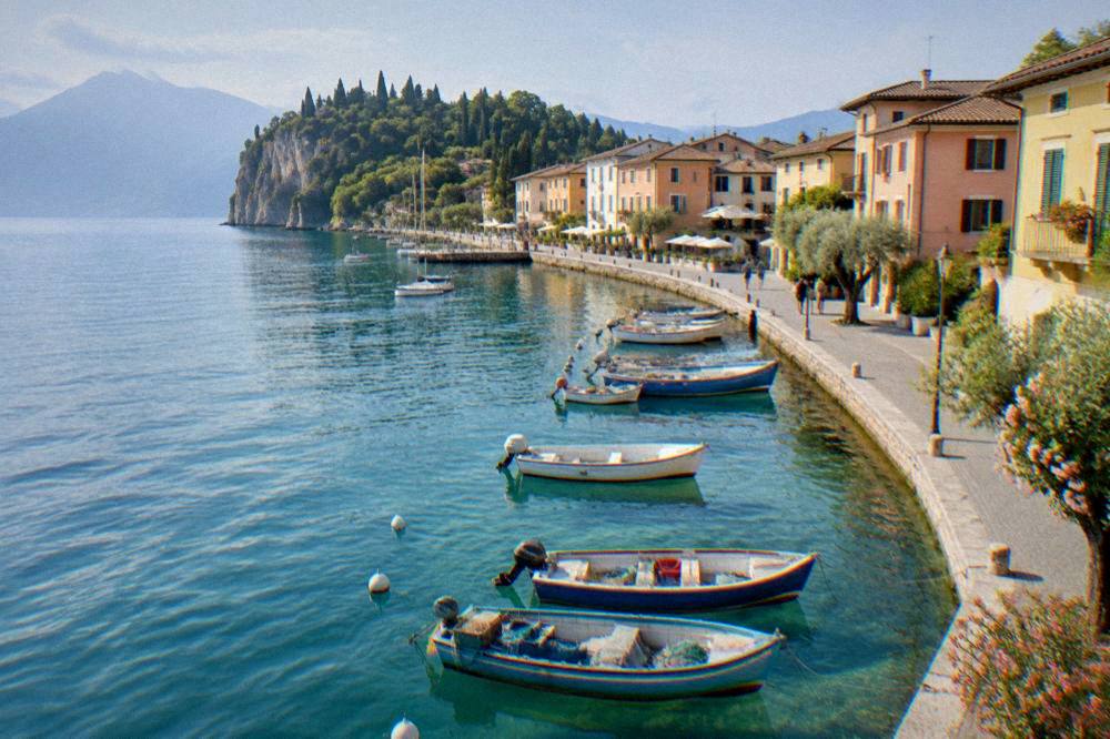 Fishing boats and pastel facades along the water at Bardolino on Lake Garda