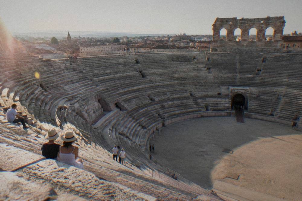 The interior stone tiers of the Arena di Verona seen from the upper gallery in daylight