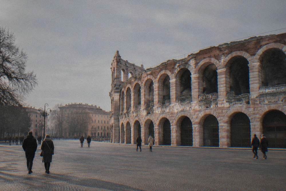 The empty stone tiers of Verona's Arena seen from ground level in winter light