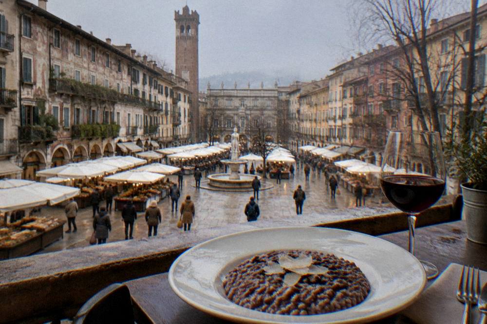 A plate of risotto all'Amarone beside a glass of red wine on a restaurant table