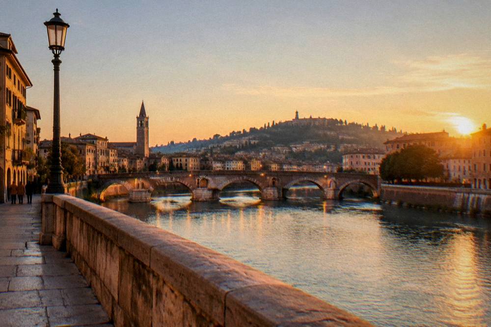 Evening view across the Adige river towards Verona's illuminated bridges and hilltop viewpoint