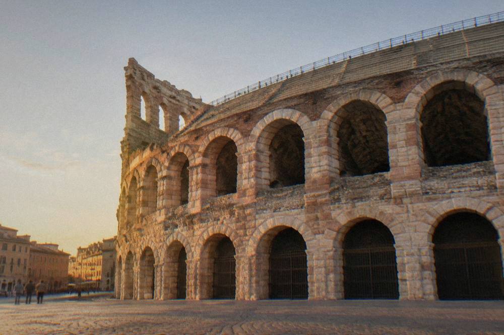 Rows of numbered stone seats on the upper steps of the Arena of Verona, empty before a performance