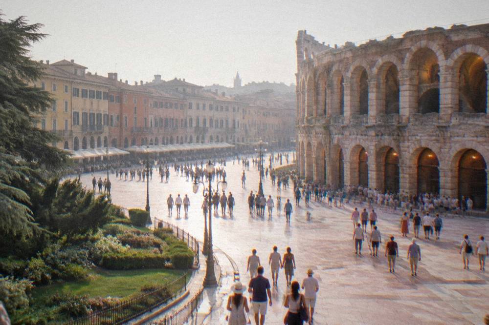 Crowds crossing Piazza Bra toward the lit arches of the Arena on a summer evening
