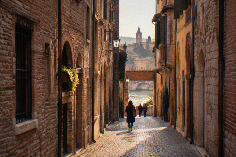 A narrow cobbled street with old brick buildings in Verona's old town