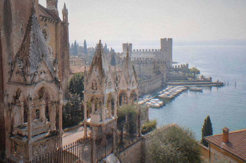 Boats moored in the harbour at Sirmione below the Scaliger Castle