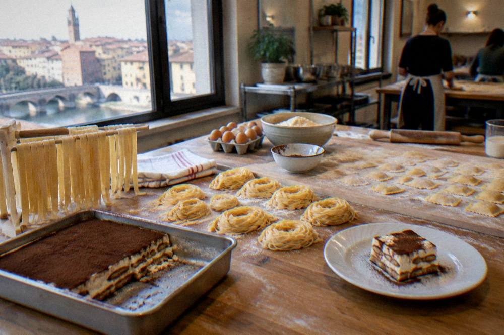 A table of freshly made pasta and tiramisu in a Verona cooking school kitchen