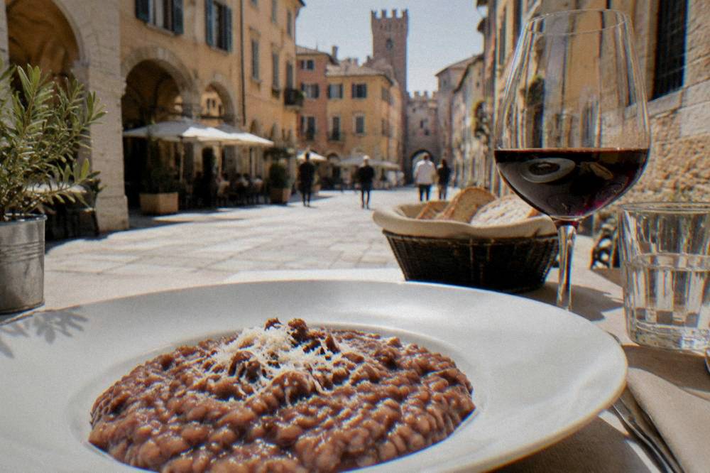 A plate of risotto all'Amarone served at a table in a Verona restaurant