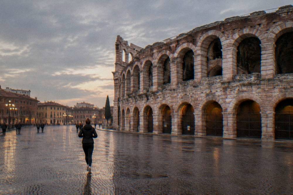 Evening sky with clouds above the open stone bowl of the Verona Arena