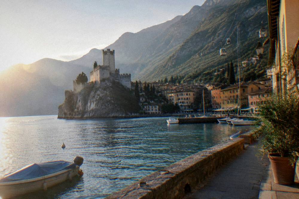 Cable car cabins rising from Malcesine toward the Monte Baldo ridge