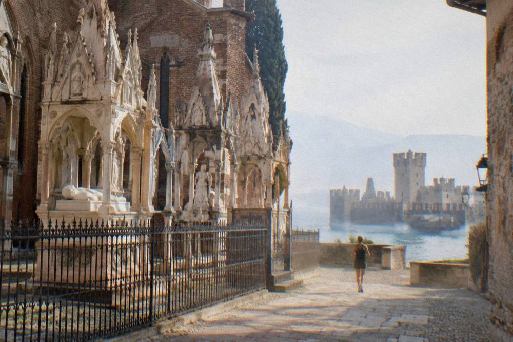 Scaliger castle walls at Sirmione under grey rain clouds above Lake Garda