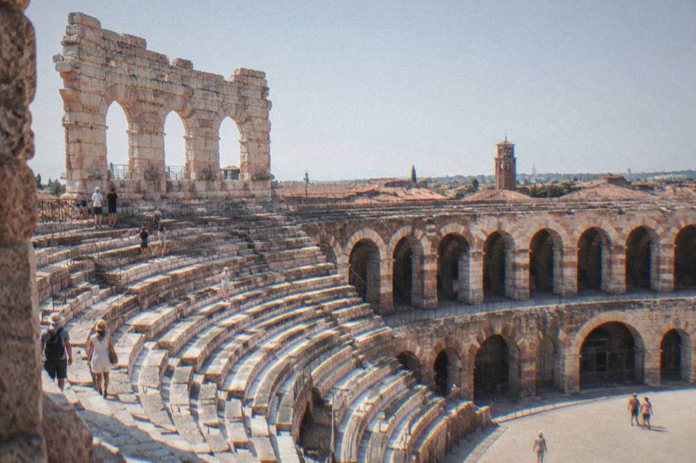 The interior stone steps and arches of the Verona Arena amphitheatre