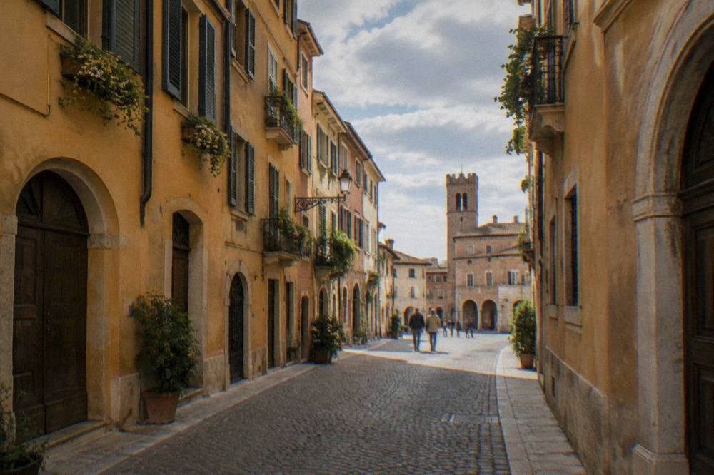A quiet cobbled lane with ochre facades in central Verona