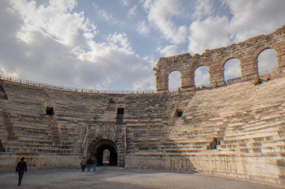 Interior arcade of the Verona Arena with stone tiers rising on both sides