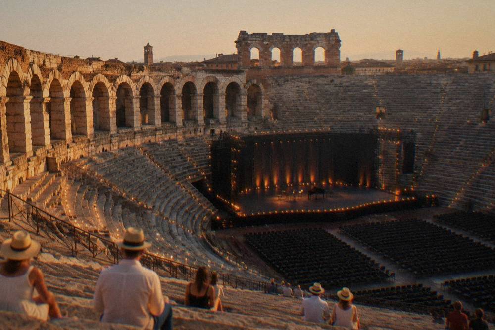A candlelit Roman amphitheatre interior prepared for an evening opera performance