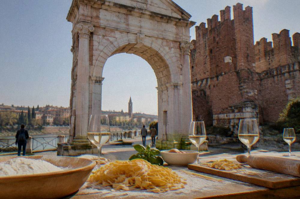 A table with fresh pasta, flour and glasses of wine ready for a cooking class